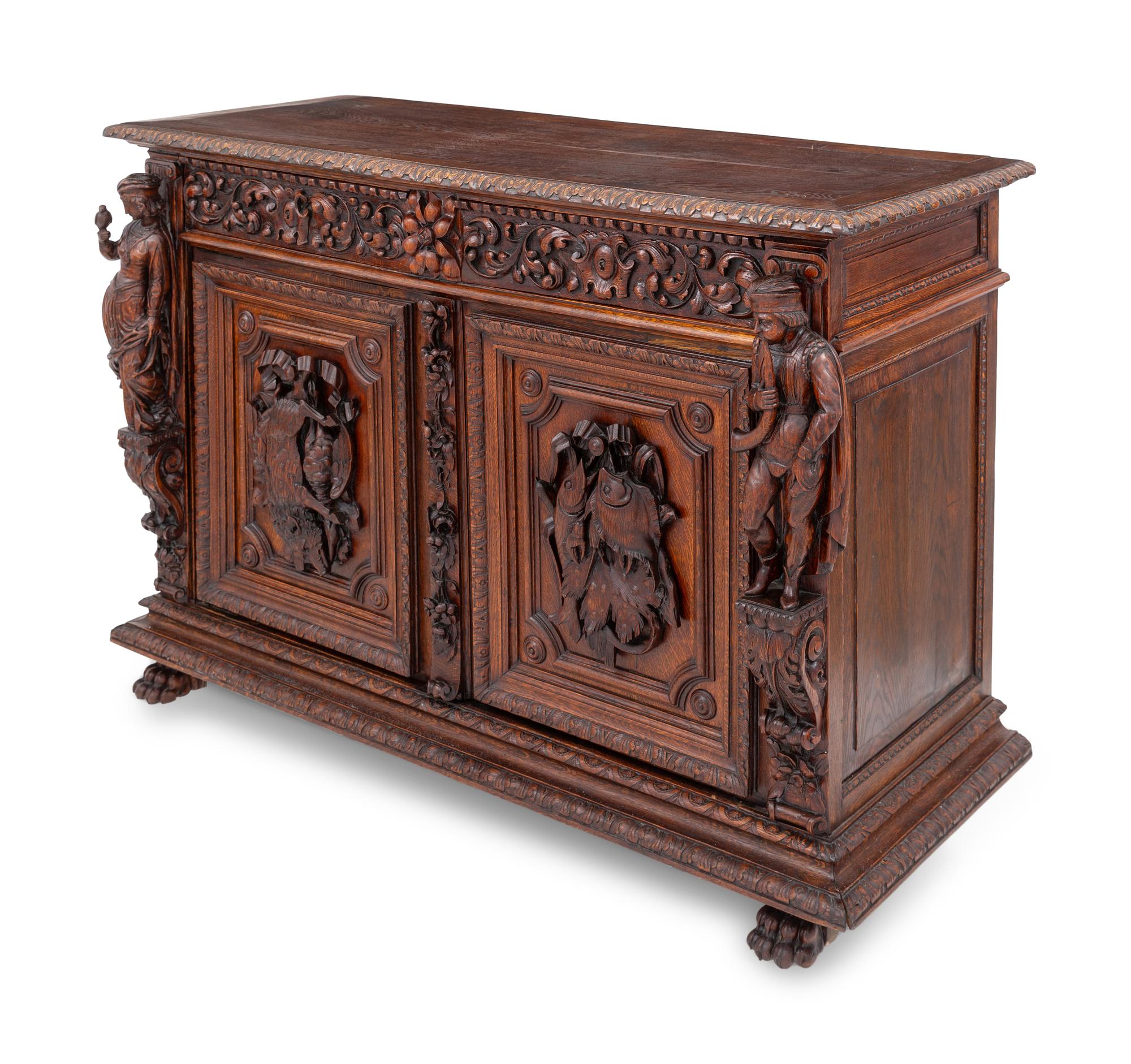 A Swiss Black Forest Carved Hunt Cabinet