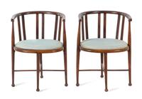 A Pair of Barrel-Back Armchairs