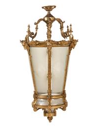 A Pair of Louis XVI Style Gilt Bronze and Frosted Glass Hall Lanterns