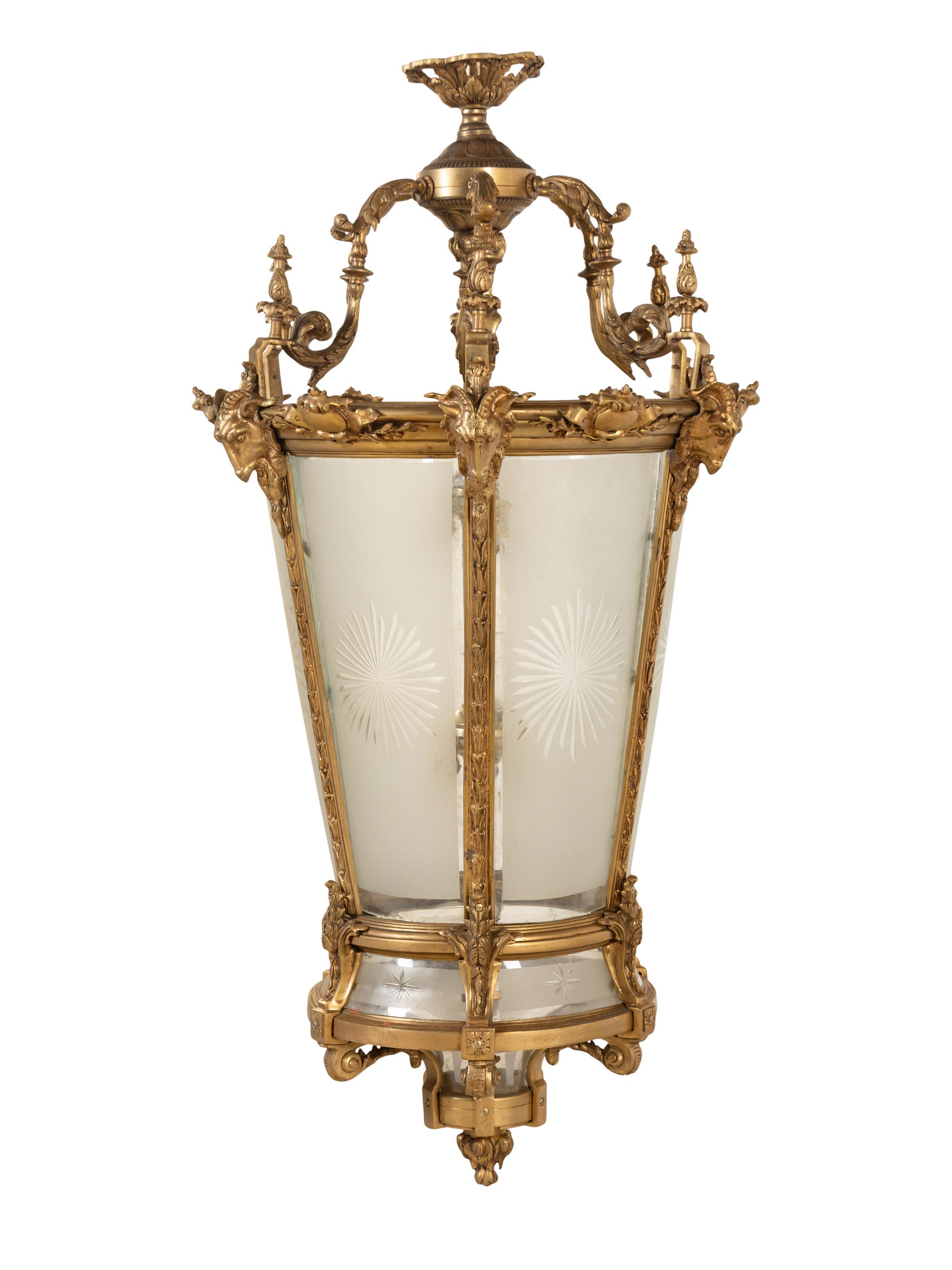 A Pair of Louis XVI Style Gilt Bronze and Frosted Glass Hall Lanterns