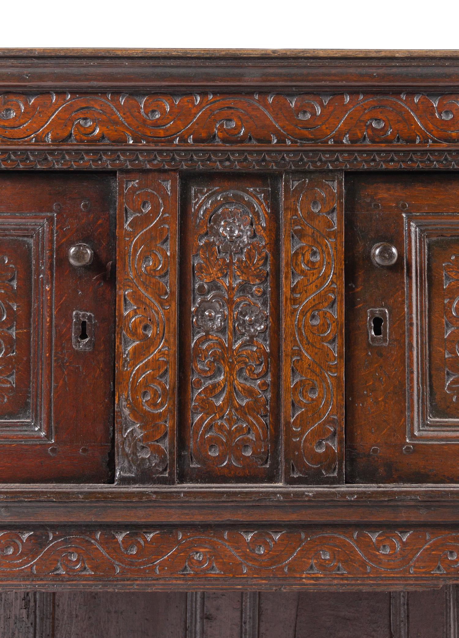 A Jacobean Carved Oak Court Cupboard