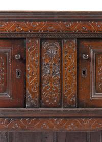 A Jacobean Carved Oak Court Cupboard
