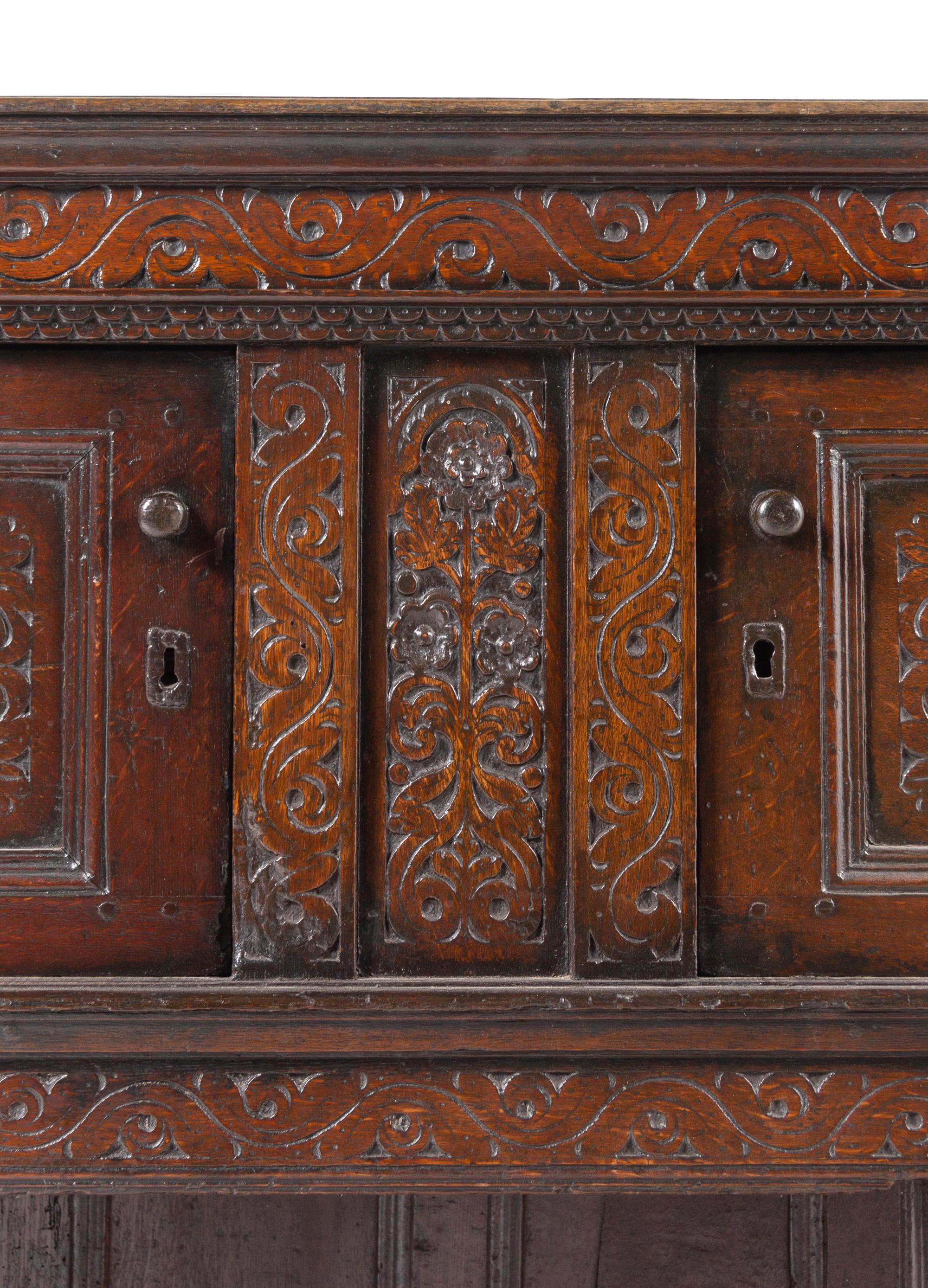 A Jacobean Carved Oak Court Cupboard