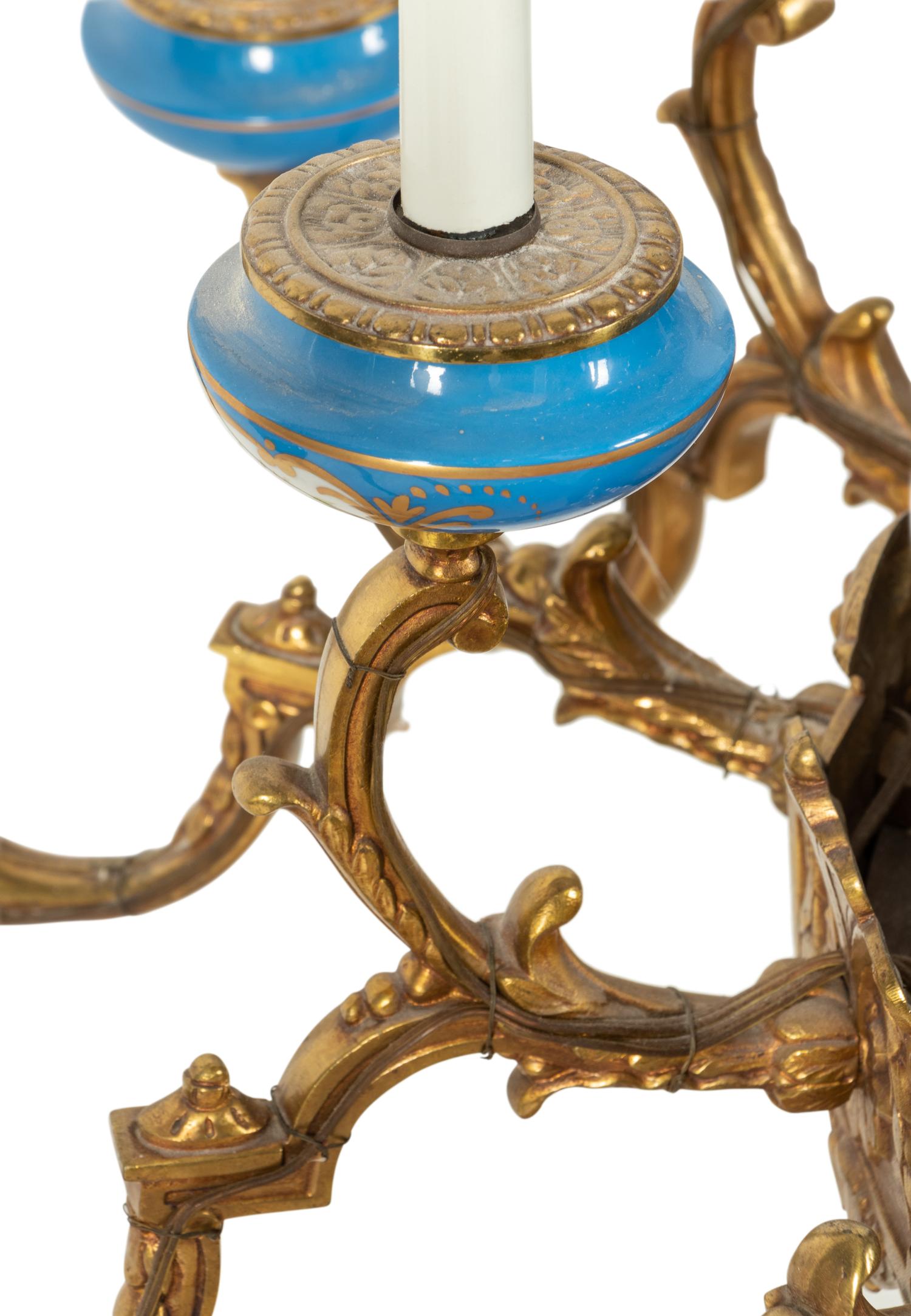 A Sèvres Style Painted Glass and Gilt Metal Mounted Eighteen-Light Chandelier