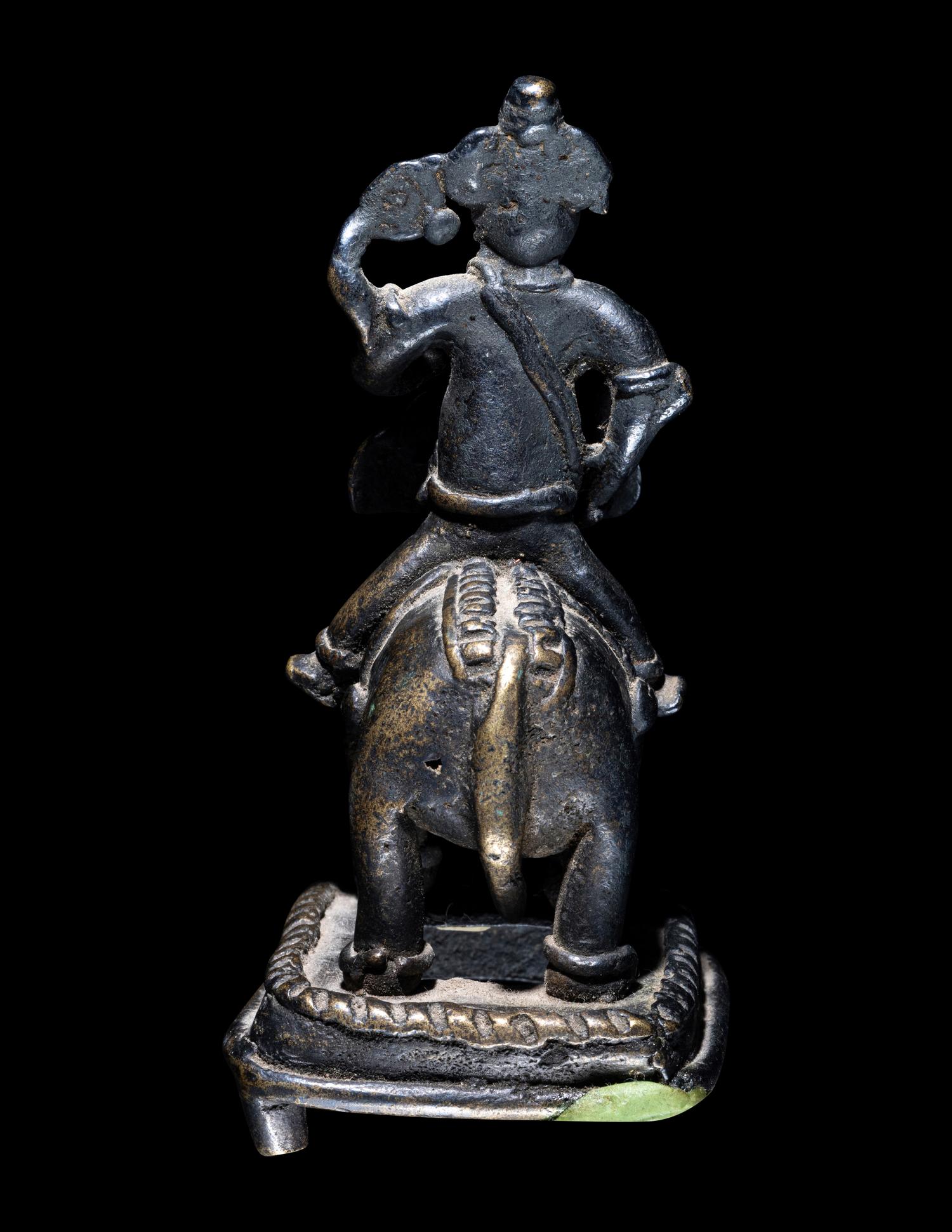 An Indian Bronze Figural Group of Ganesha Riding an Elephant