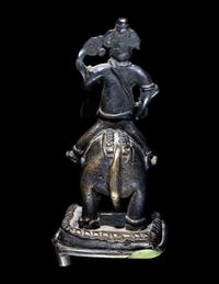 An Indian Bronze Figural Group of Ganesha Riding an Elephant