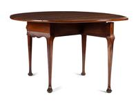 A Queen Anne Carved Cherrywood Drop-Leaf Pad-Foot Dining Table