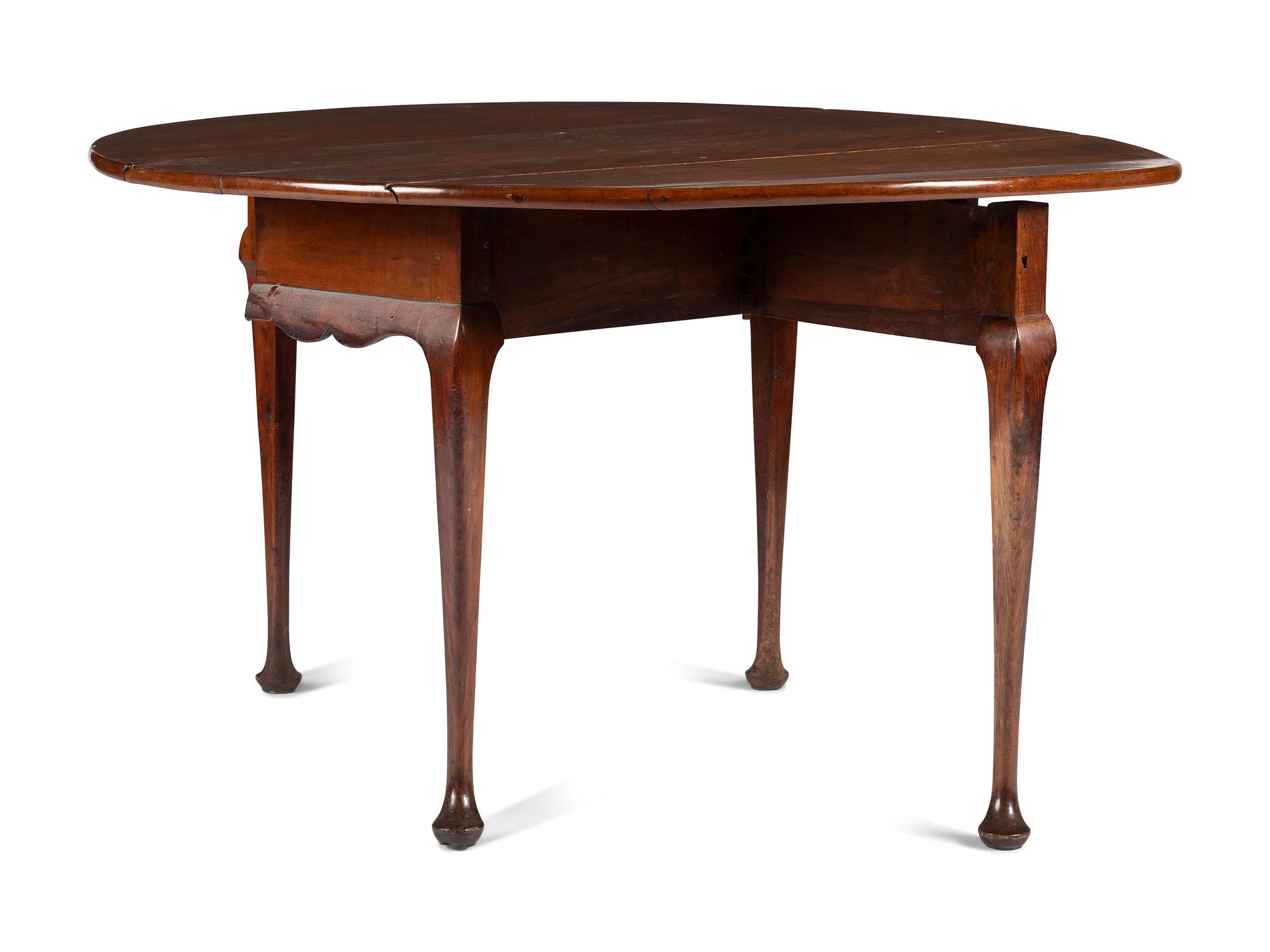 A Queen Anne Carved Cherrywood Drop-Leaf Pad-Foot Dining Table
