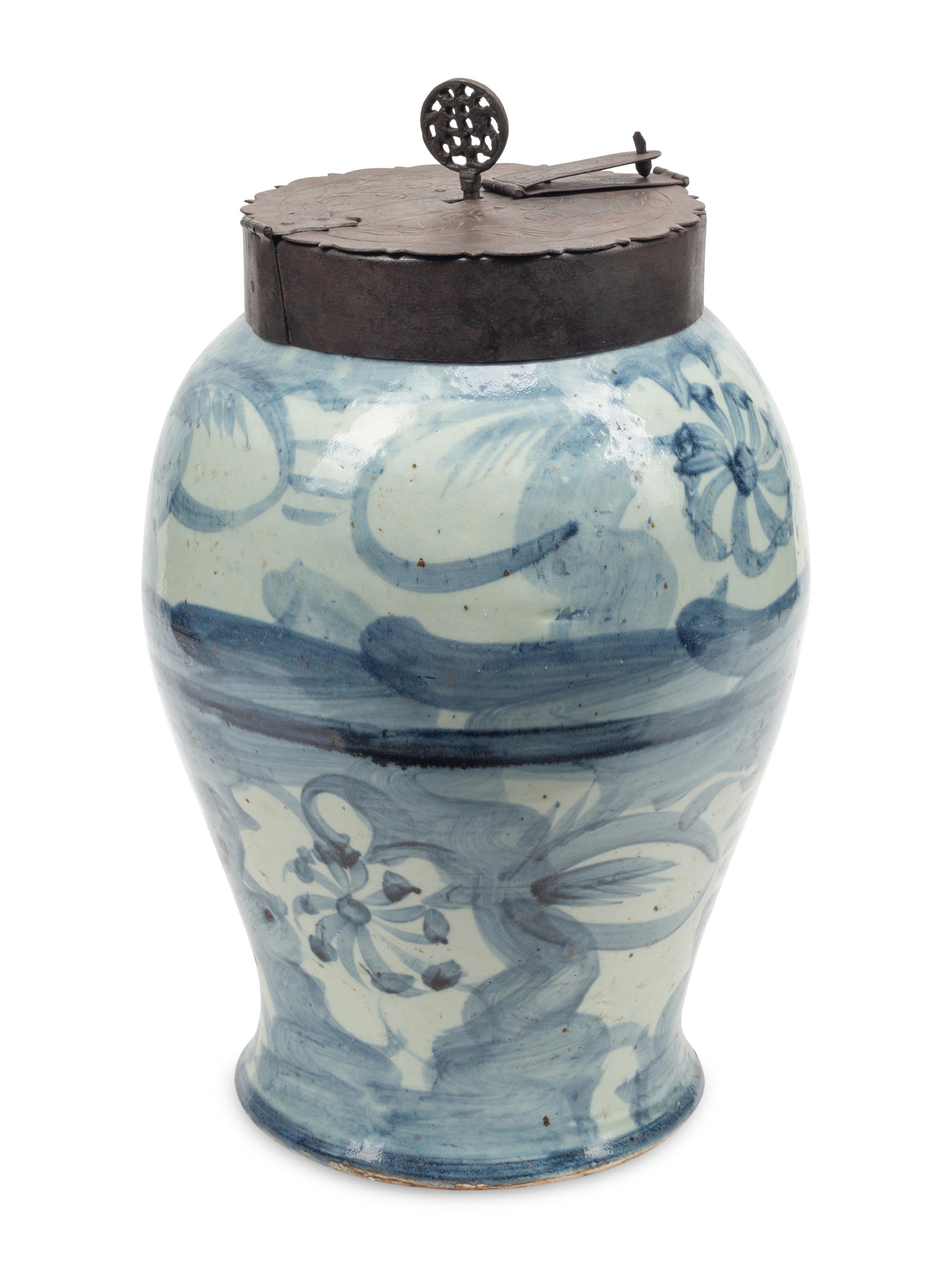 An Iron Mounted Blue and White Porcelain Locking Tea Caddy