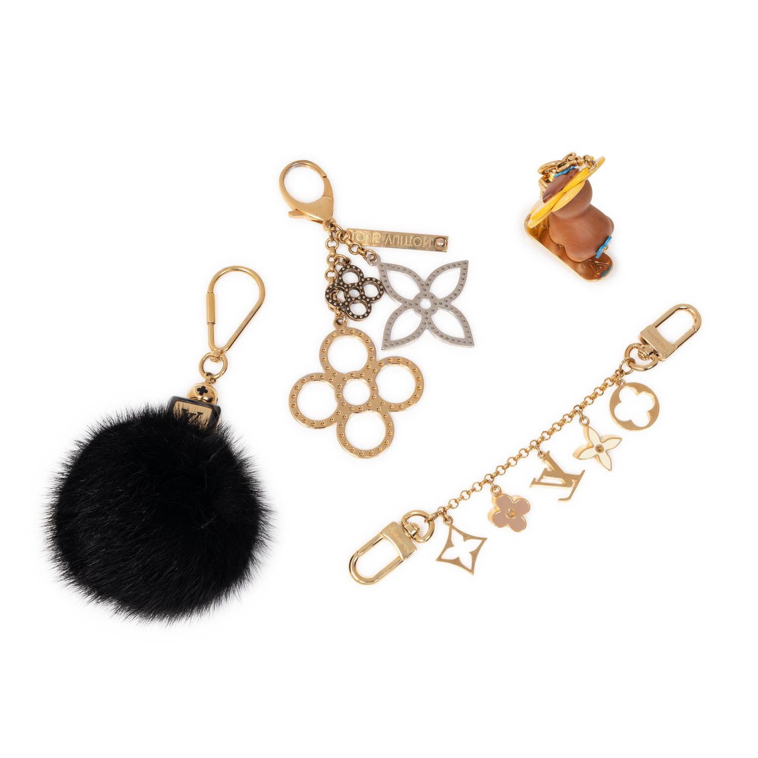 LOUIS VUITTON, GROUP OF FOUR BAG CHARMS