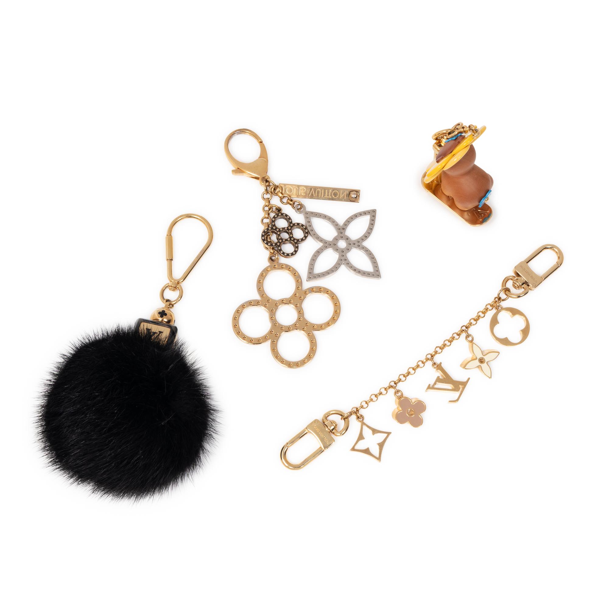 LOUIS VUITTON, GROUP OF FOUR BAG CHARMS