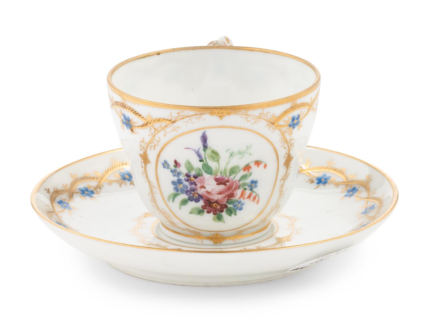 A Nicholas II Imperial Porcelain Factory Teacup and Saucer