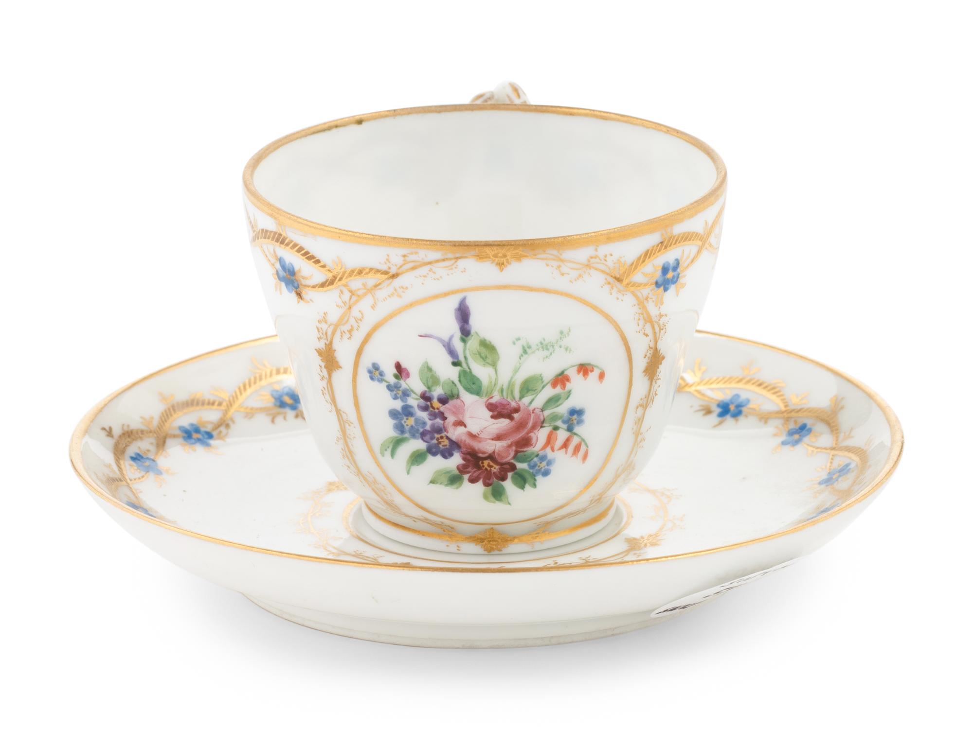 A Nicholas II Imperial Porcelain Factory Teacup and Saucer
