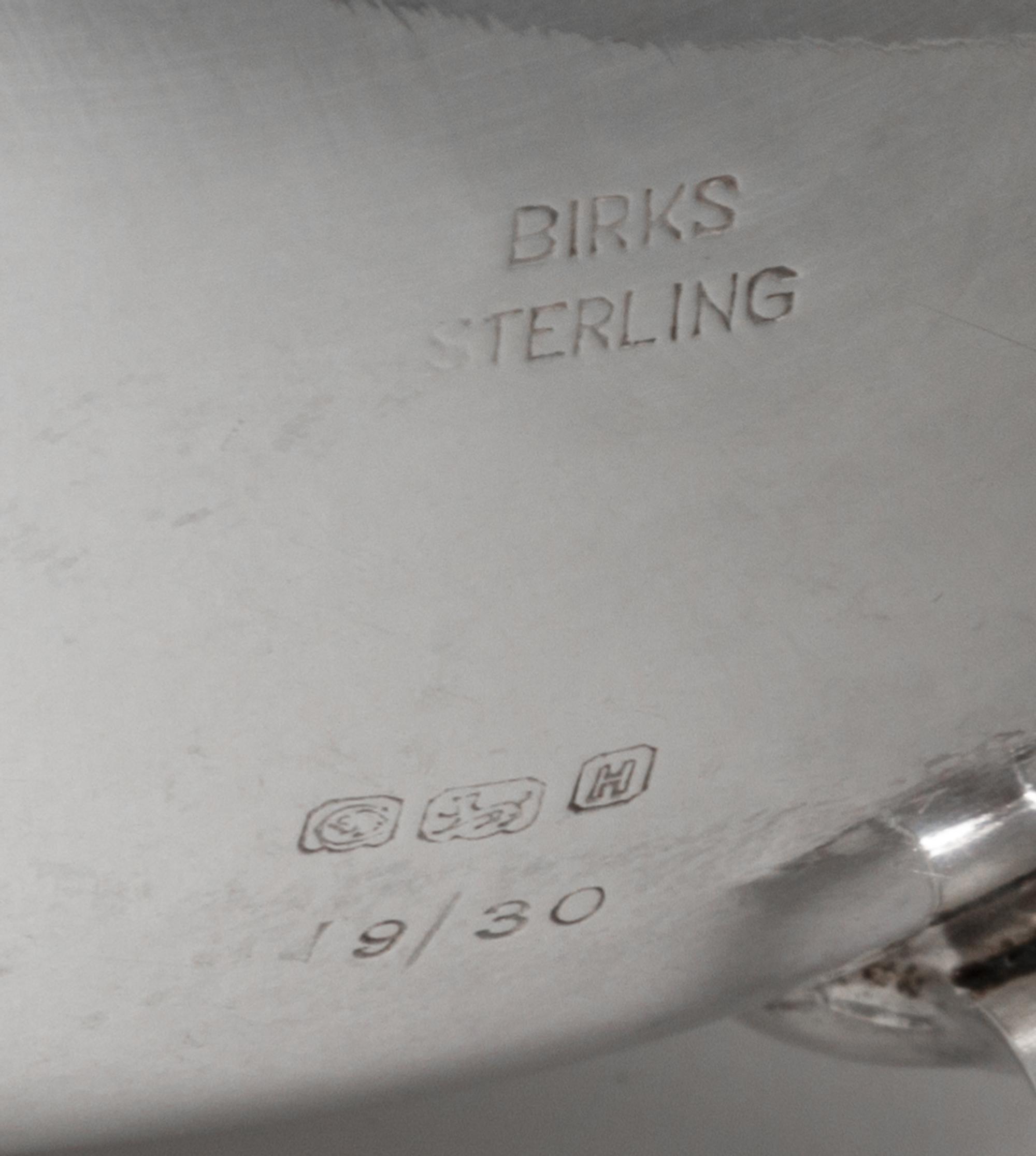 A Canadian Silver Sauce Boat, Henry Birks & Sons, Montreal, 20th Century, of typical form with a gadrooned border and leaf-capped flyin