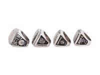 A Group of Four Northwestern University Football and Basketball Championship Rings,