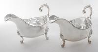 A Pair of English Silver-plate Sauce Boats, Elkington & Co., Birmingham, 20th Century, of typical boat form raised on three scroll feet