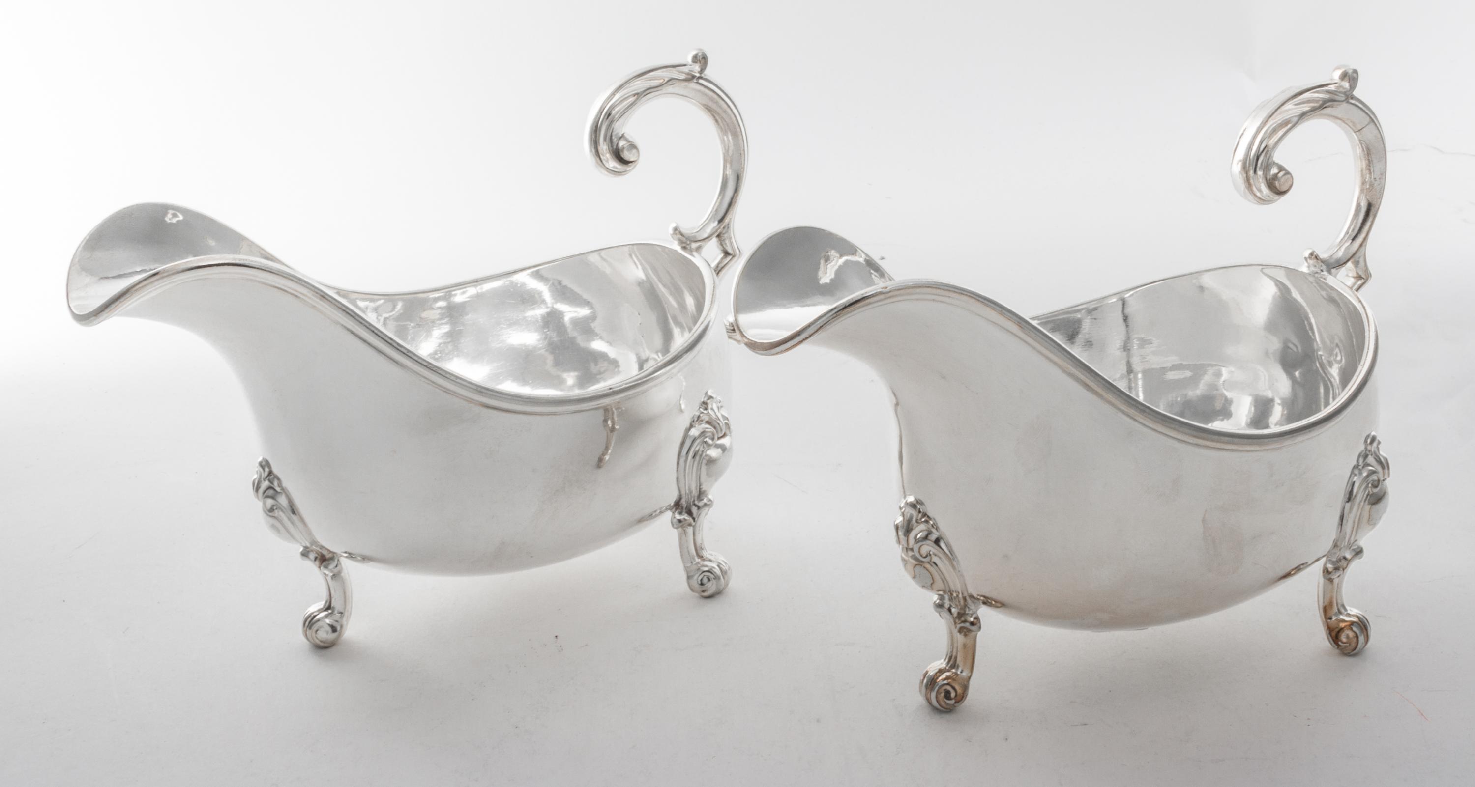 A Pair of English Silver-plate Sauce Boats, Elkington & Co., Birmingham, 20th Century, of typical boat form raised on three scroll feet