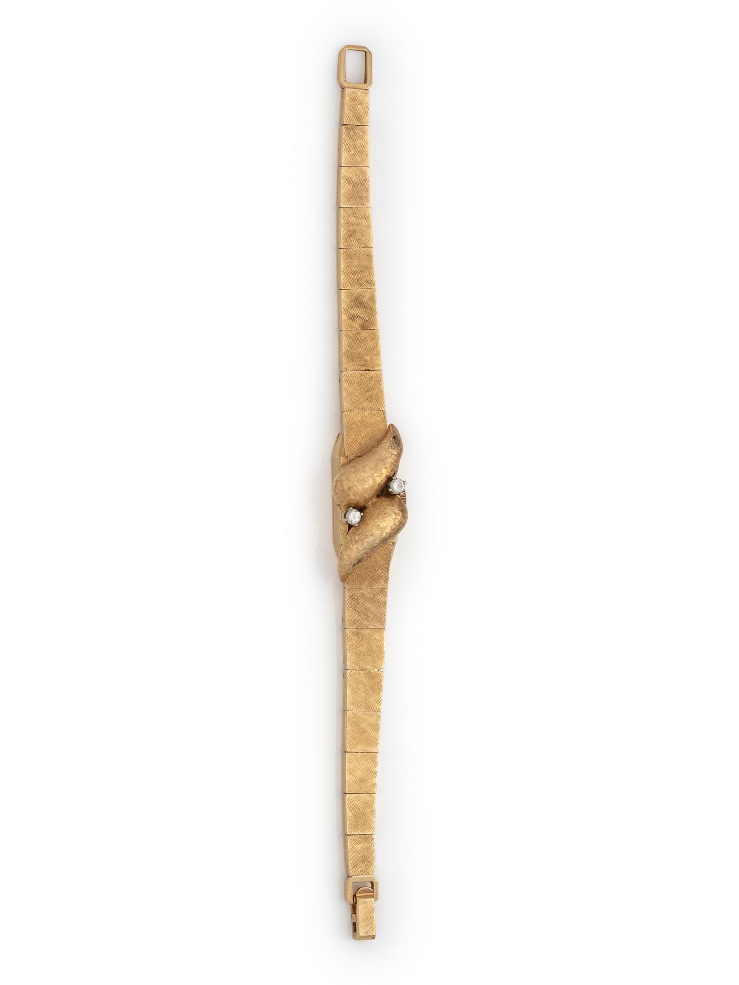 SOLD: 14K YELLOW GOLD AND DIAMOND SURPRISE WRISTWATCH
