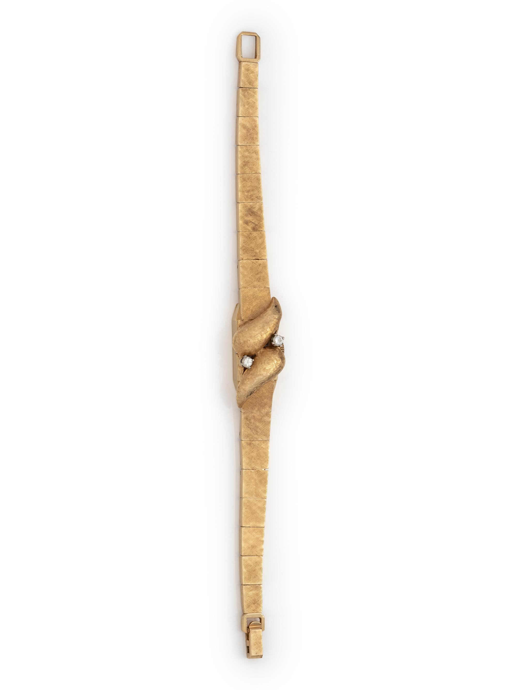 SOLD: 14K YELLOW GOLD AND DIAMOND SURPRISE WRISTWATCH