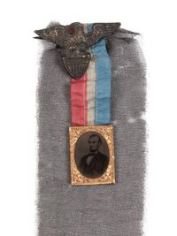 [LINCOLN'S FUNERAL]. A mourning badge with ferrotype image of Abraham Lincoln, ca. 19 April 1865.