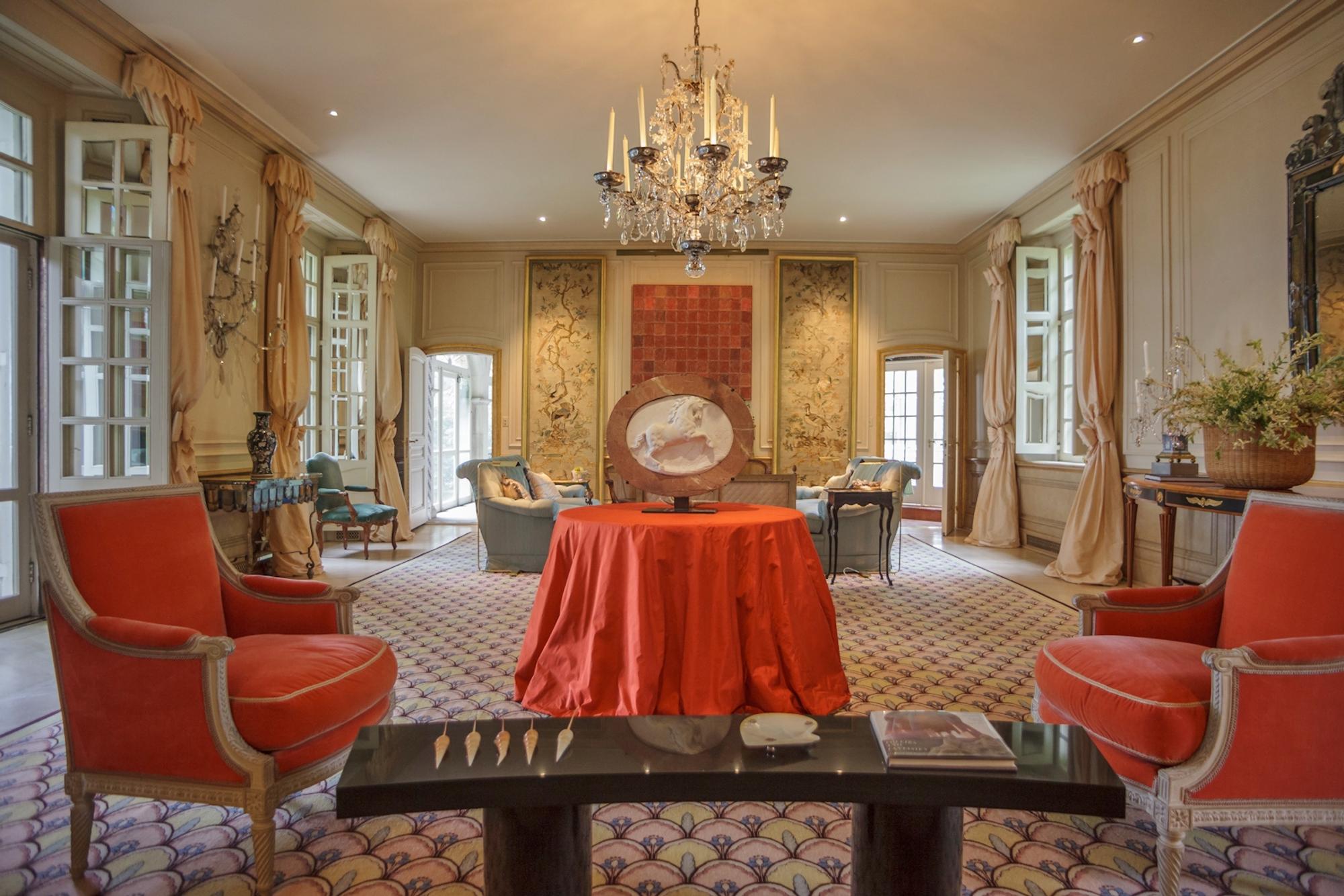 A Louis XVI Style Painted and Leather-Upholstered Ottoman