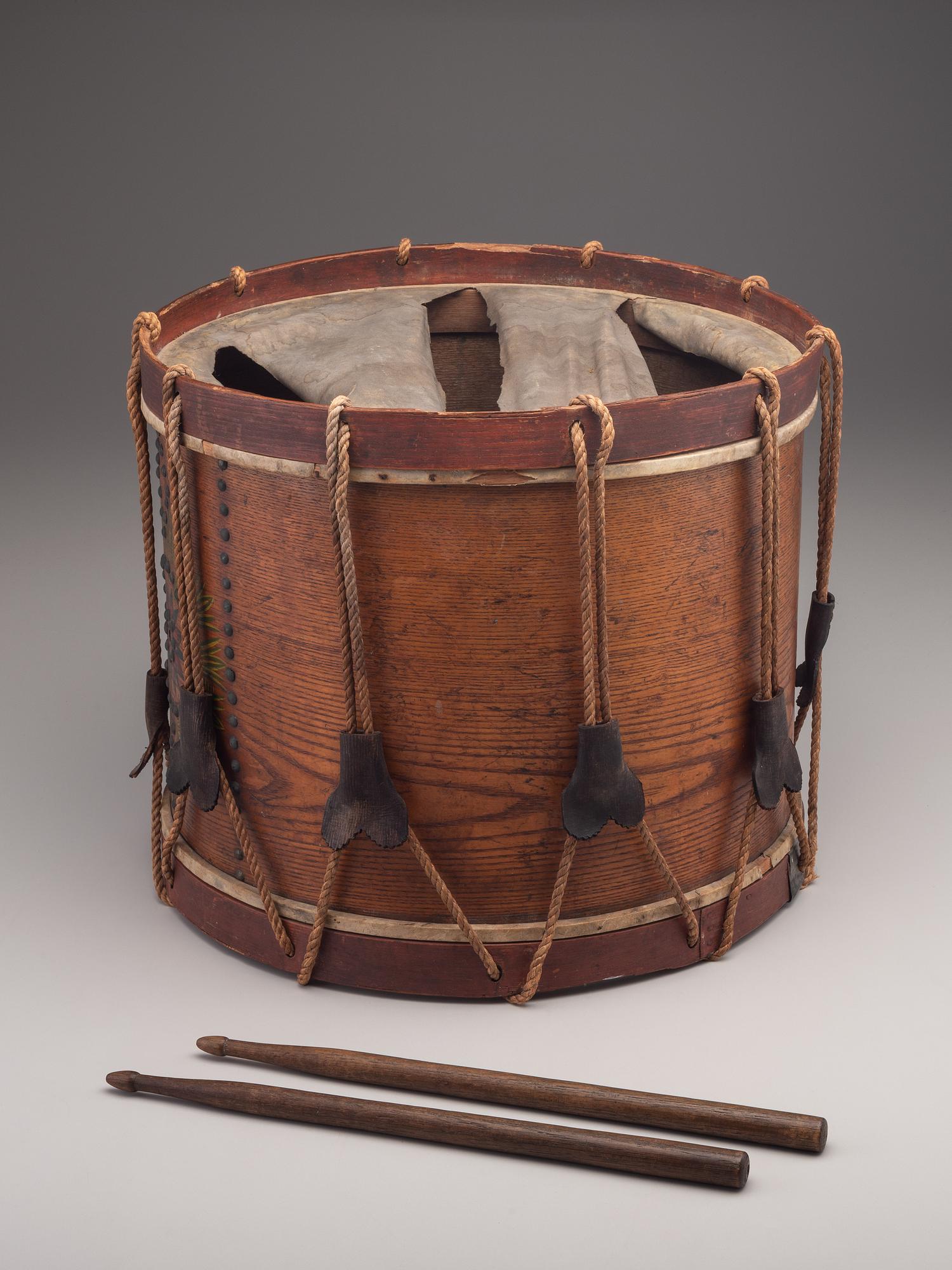 [MILITARIA]. Possibly Mexican War painted drum featuring ornate tack design, with drumsticks.