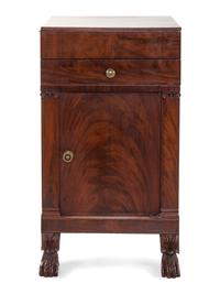A Classical Carved and Figured Mahogany Commode Cabinet
