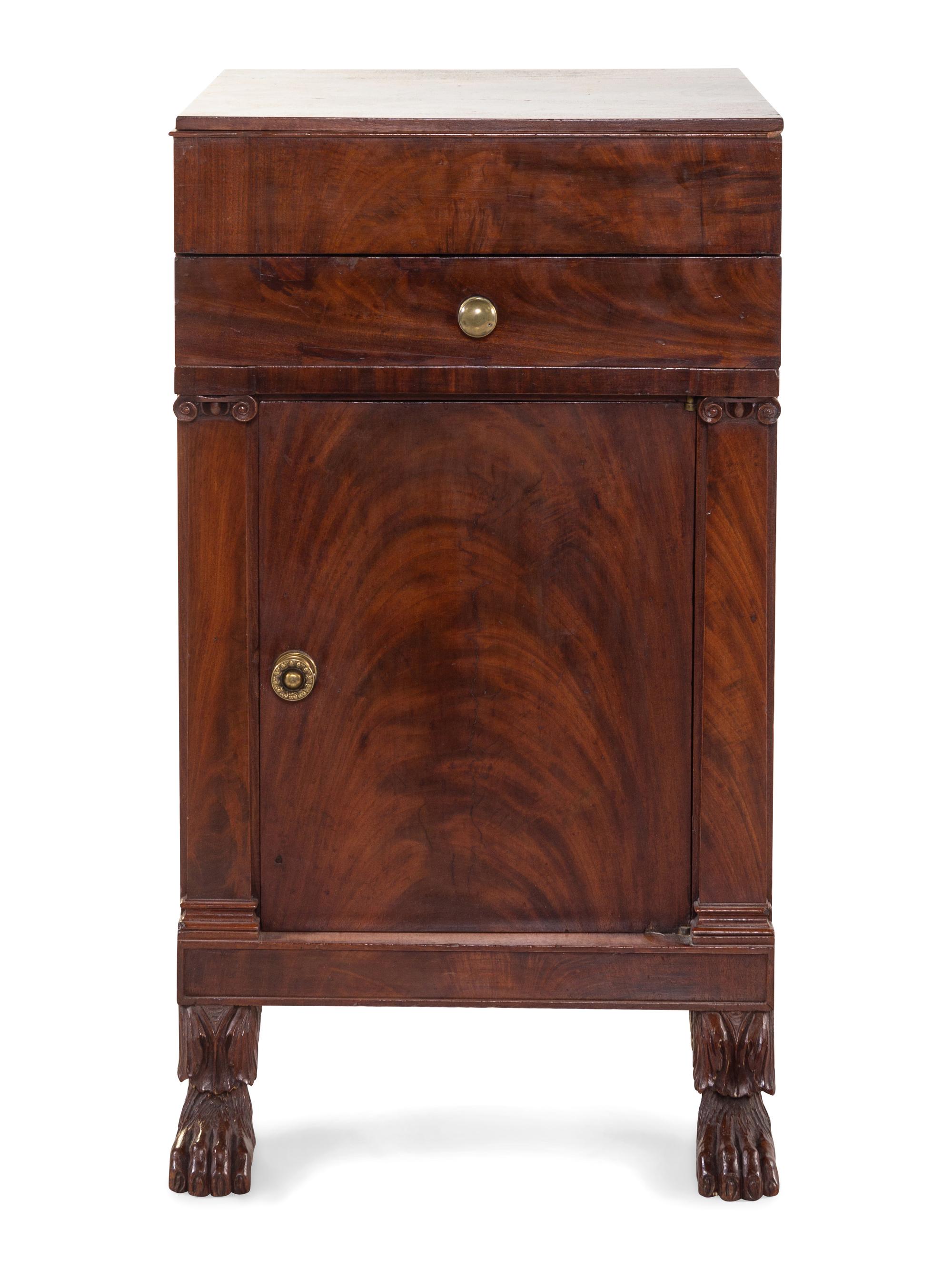 A Classical Carved and Figured Mahogany Commode Cabinet