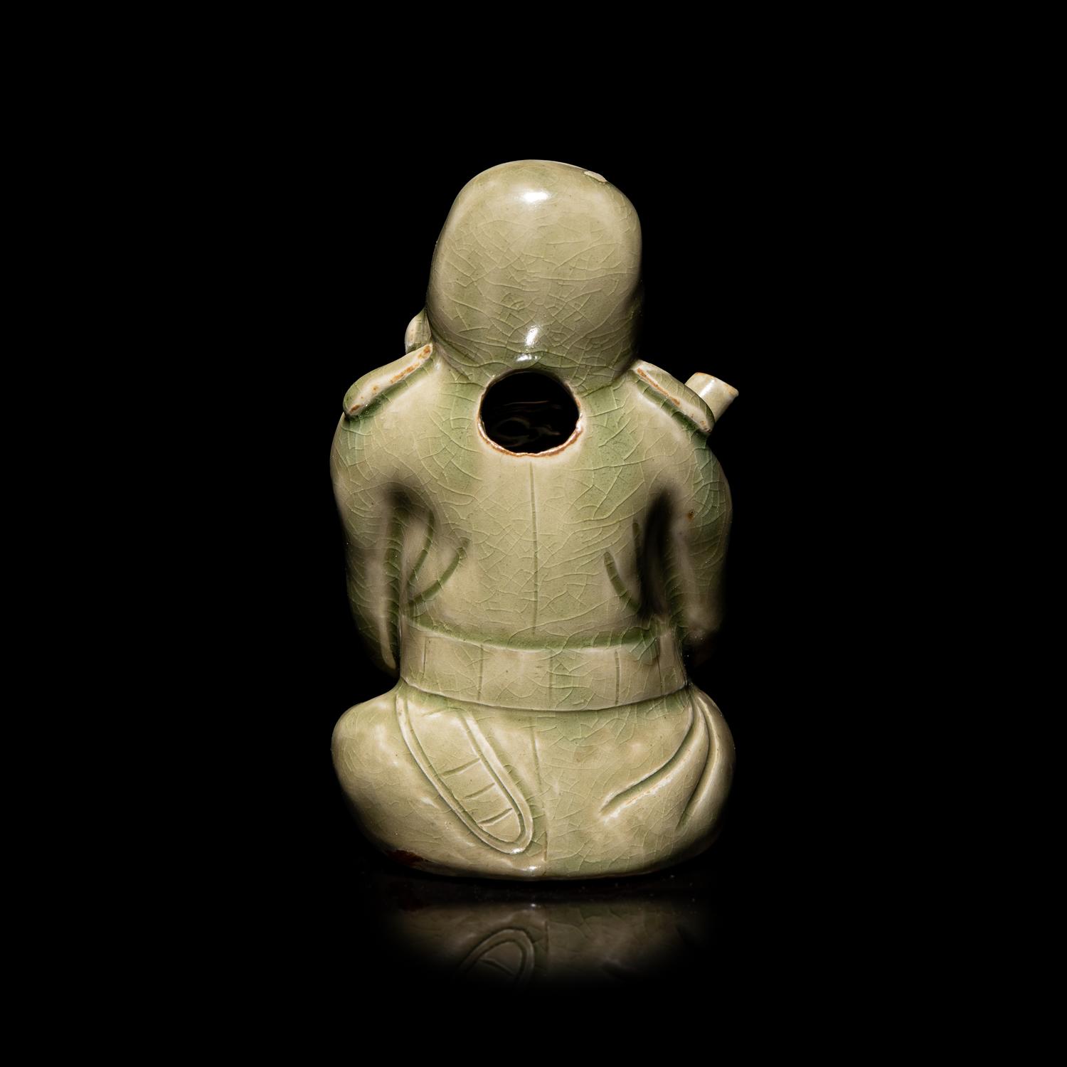 A Chinese Celadon Glazed Porcelain Figure Water Dropper, Yandi — 青釉人物形硯滴