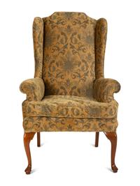 A Queen Anne Style Upholstered Wing Back Armchair — 20th Century