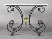 A French Iron and Marble Work Table, Height 33 x width 43 1/4 x depth 23 1/2 inches.