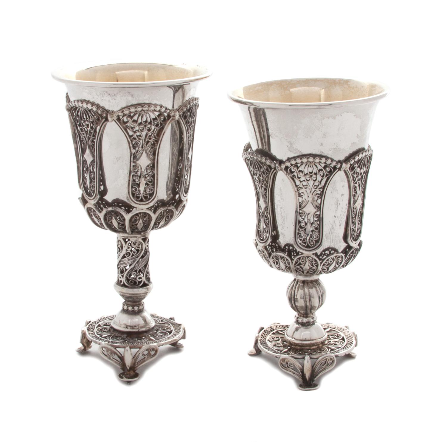 Two Continental Silver Filigree Goblets, Late 19th Century, each with a solid silver liner, raised on a tripartite base.