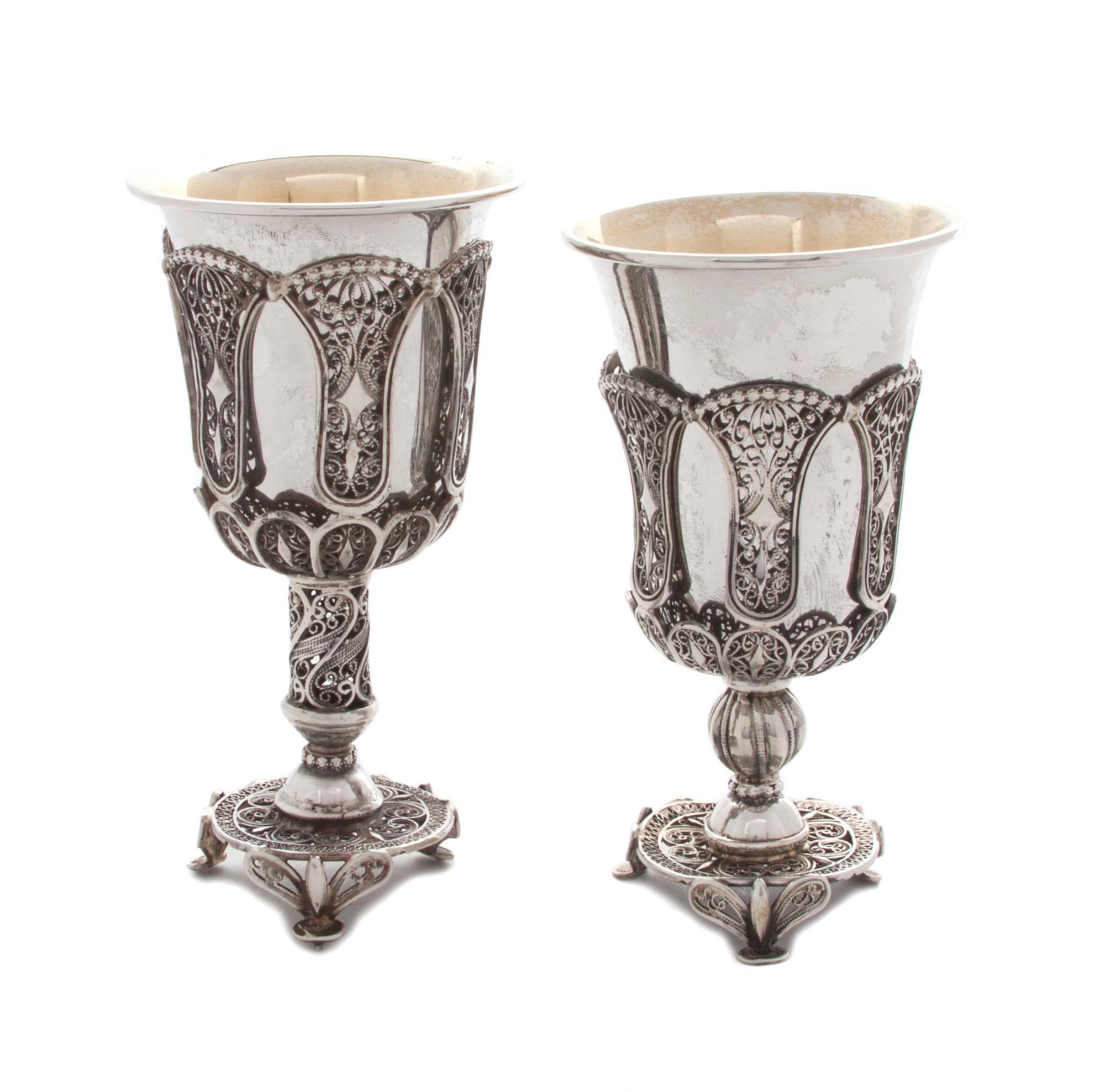 Two Continental Silver Filigree Goblets, Late 19th Century, each with a solid silver liner, raised on a tripartite base.
