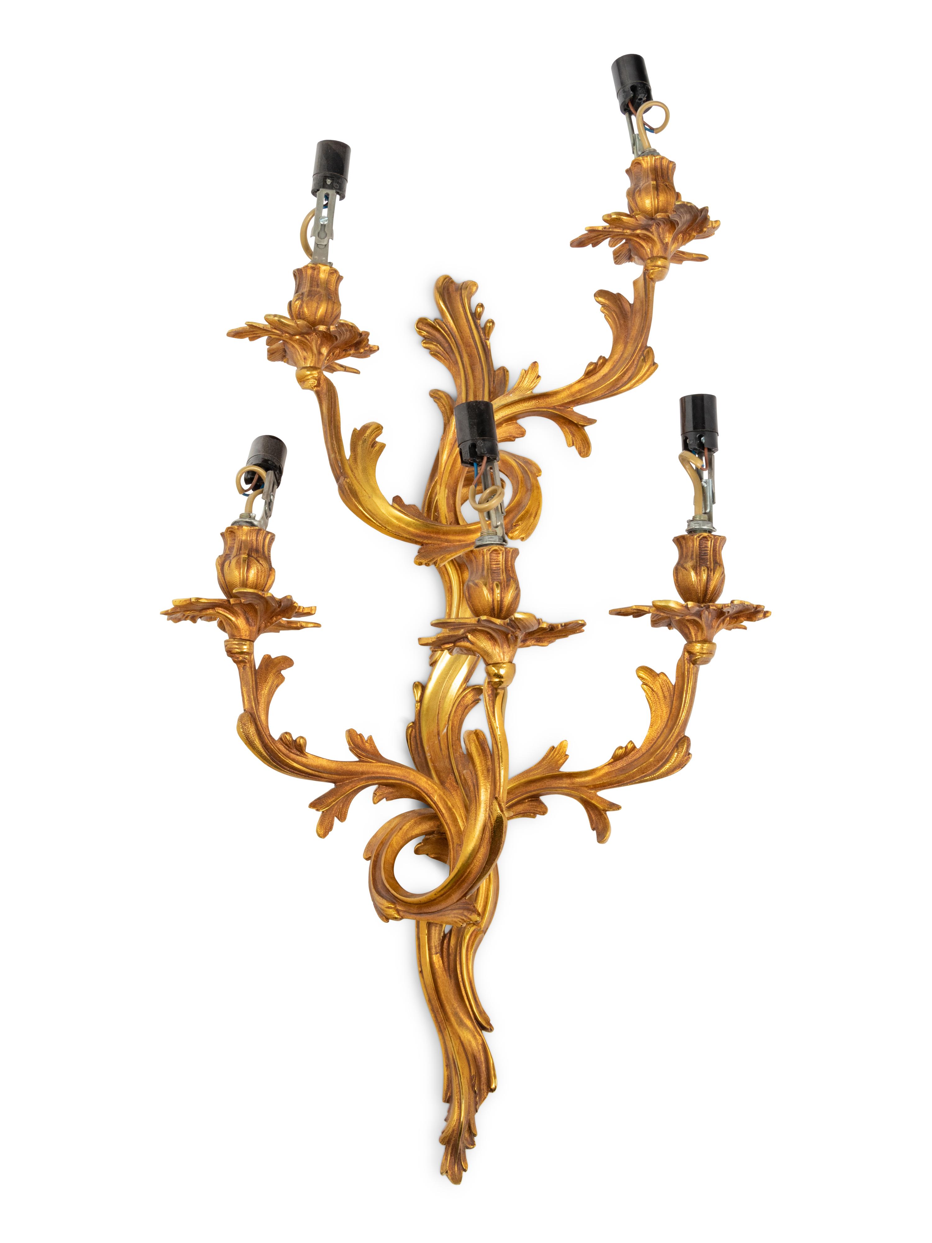 A Set of Four Louis XV Style Gilt Metal Five-Light Sconces