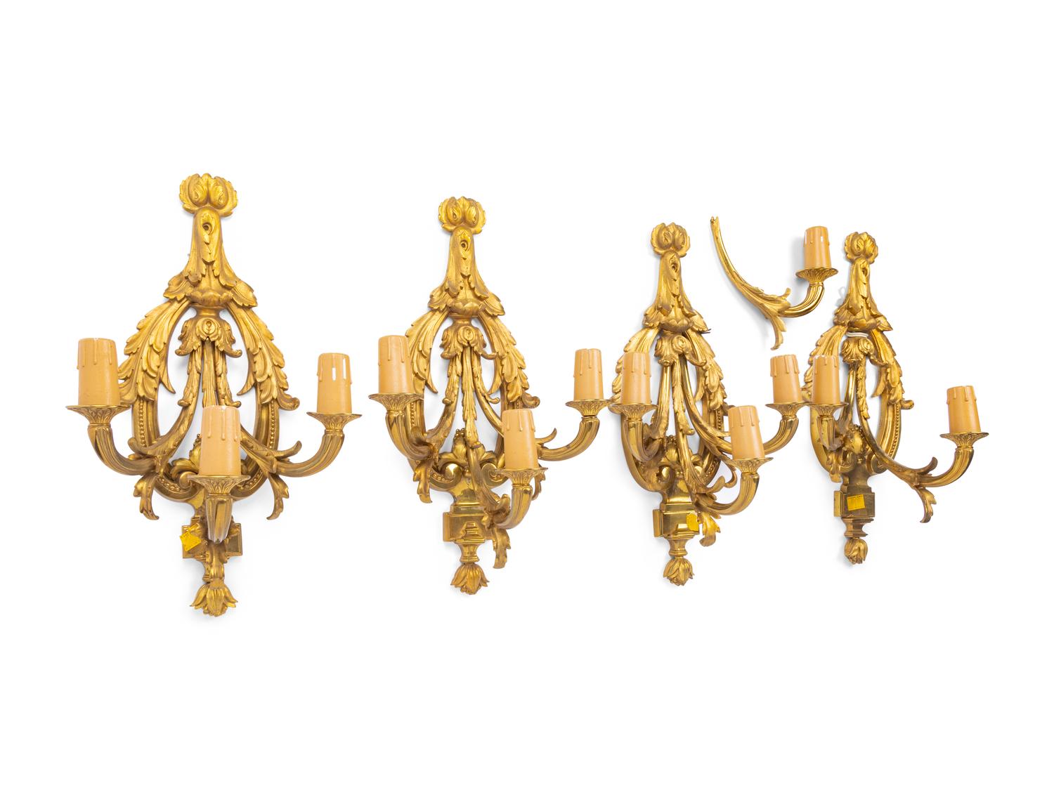 A Set of Four Louis XVI Style Gilt Metal Three-Light Sconces