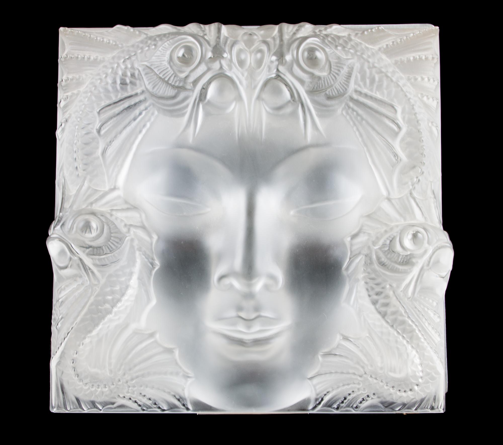 A Lalique Molded and Frosted Glass Figurine Mask on Stand Height 14 x width 14 inches.