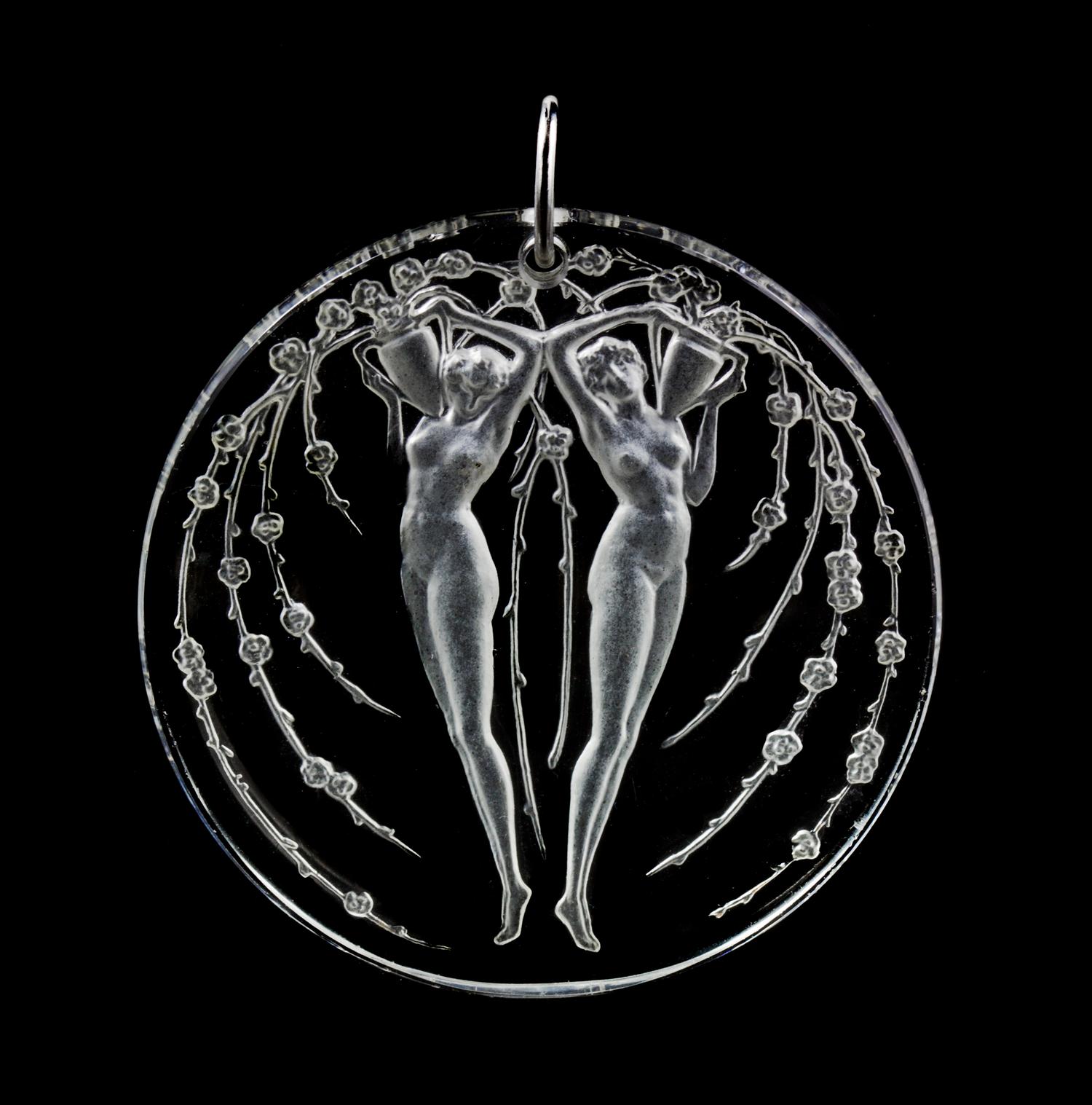 A Molded Glass and Platinum 'Deux Figurines Et Fleurs' Pendant, Rene Lalique,