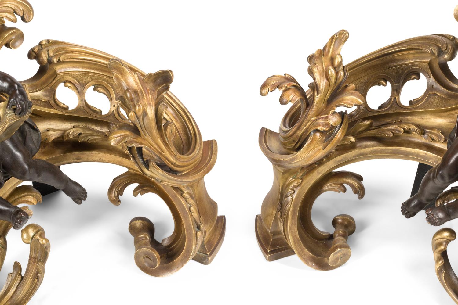 A Pair of Louis XV Style Gilt and Patinated Bronze Figural Chenets