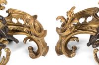 A Pair of Louis XV Style Gilt and Patinated Bronze Figural Chenets
