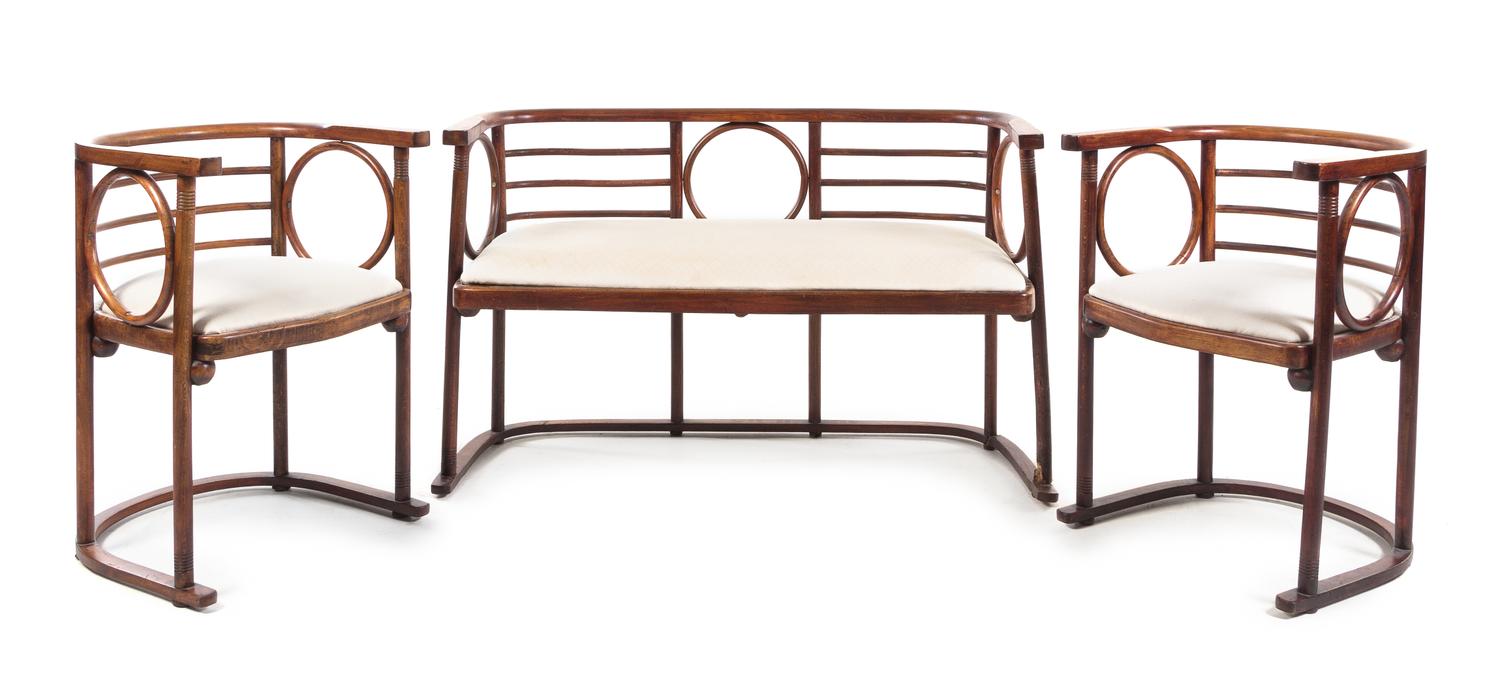 Attributed to Josef Hoffmann, Austria, c.1905, a four-piece salon suite comprising a settee, two armchairs and a side table