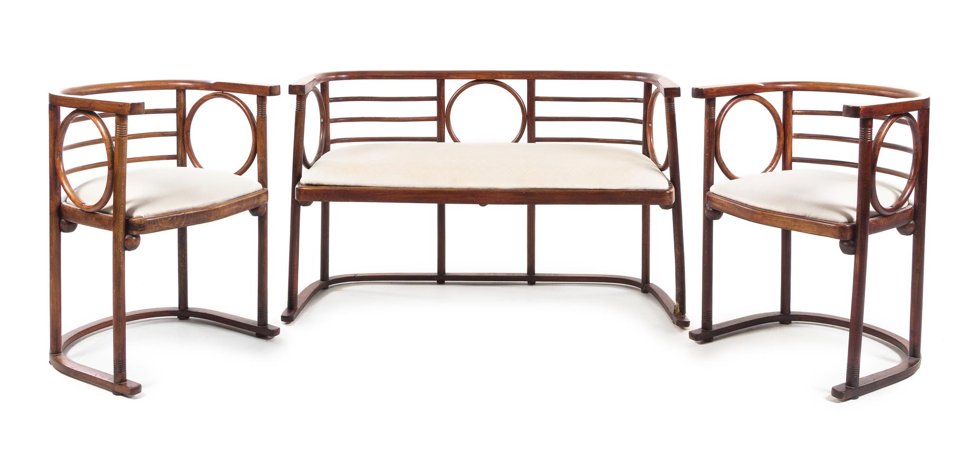 Attributed to Josef Hoffmann, Austria, c.1905, a four-piece salon suite comprising a settee, two armchairs and a side table