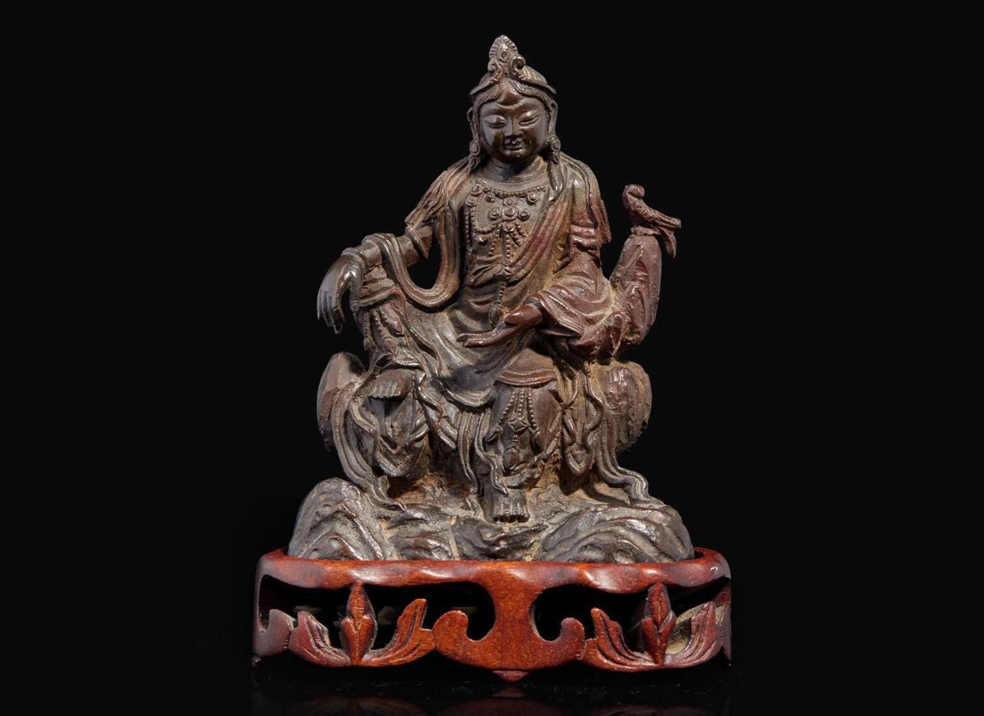 A small patinated bronze figure of "Water-Moon" Guanyin, 17th/18th century or earlier 銅加漆水月觀音像 十七至十八世紀或更早