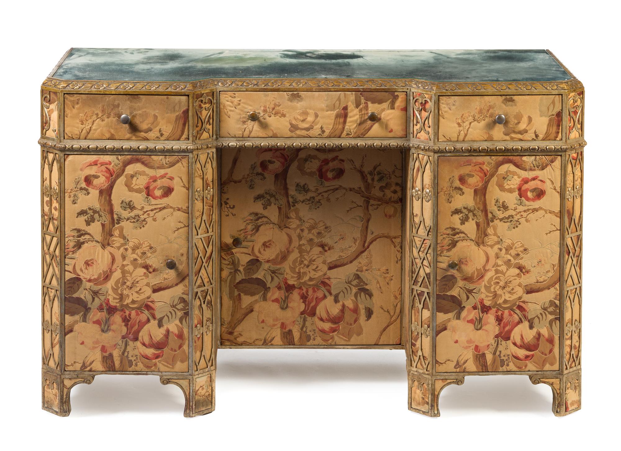 An Art Deco Silvered and Fabric Veneered Dressing Table Height 55 x width 48 x depth 20 inches.