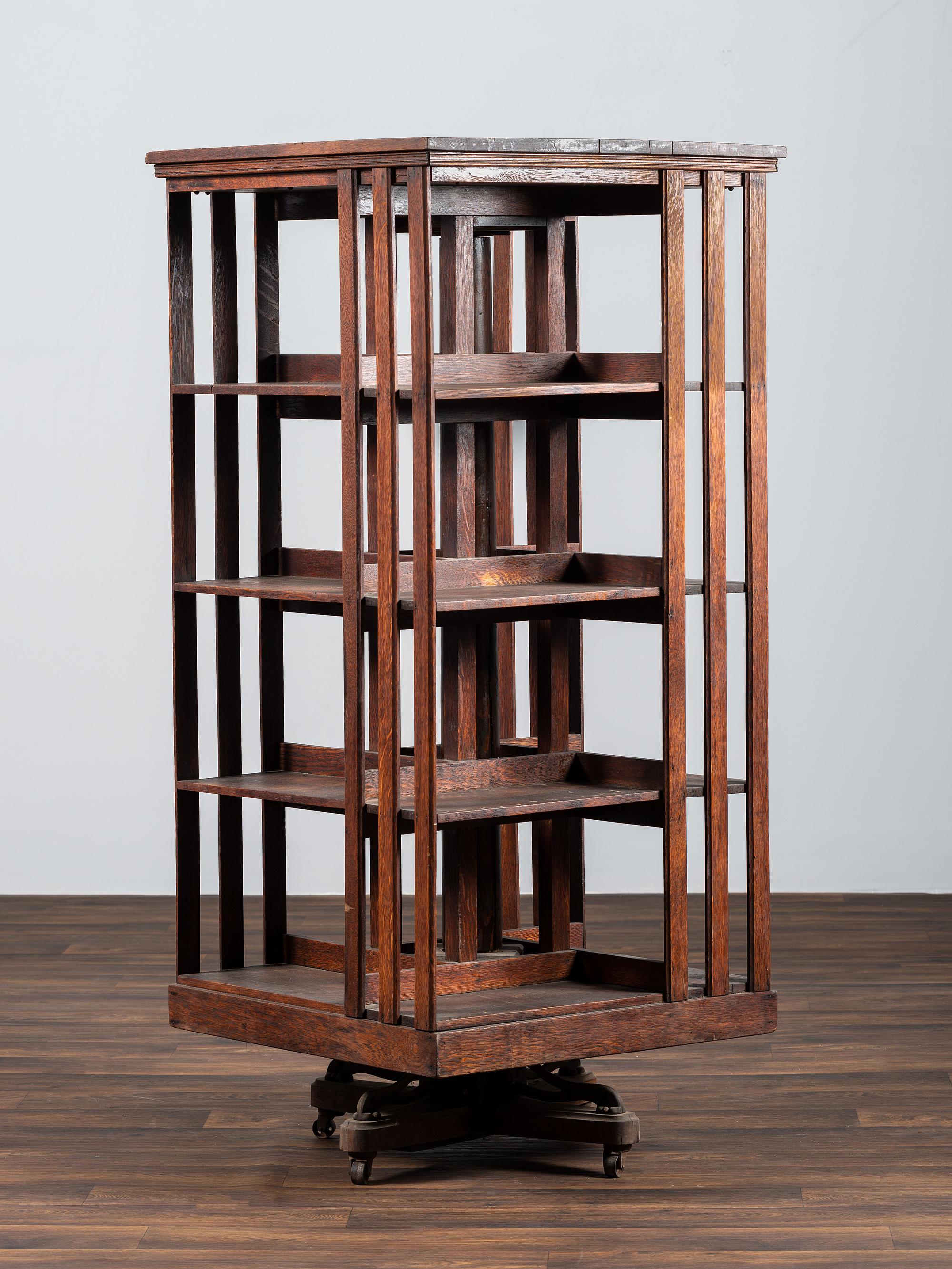 A Country Store Iron-Mounted Oak Rotating Bookshelf
