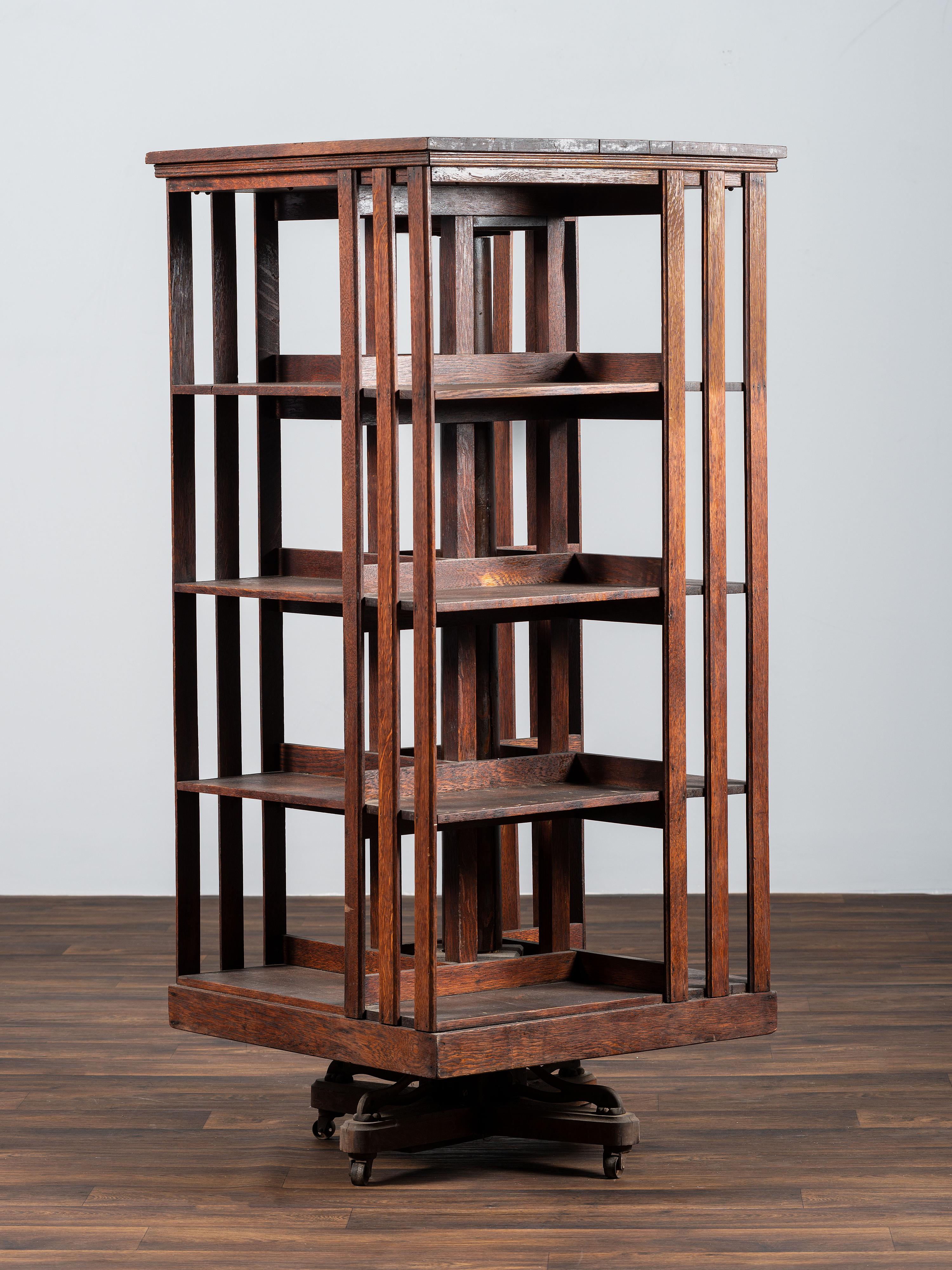 A Country Store Iron-Mounted Oak Rotating Bookshelf