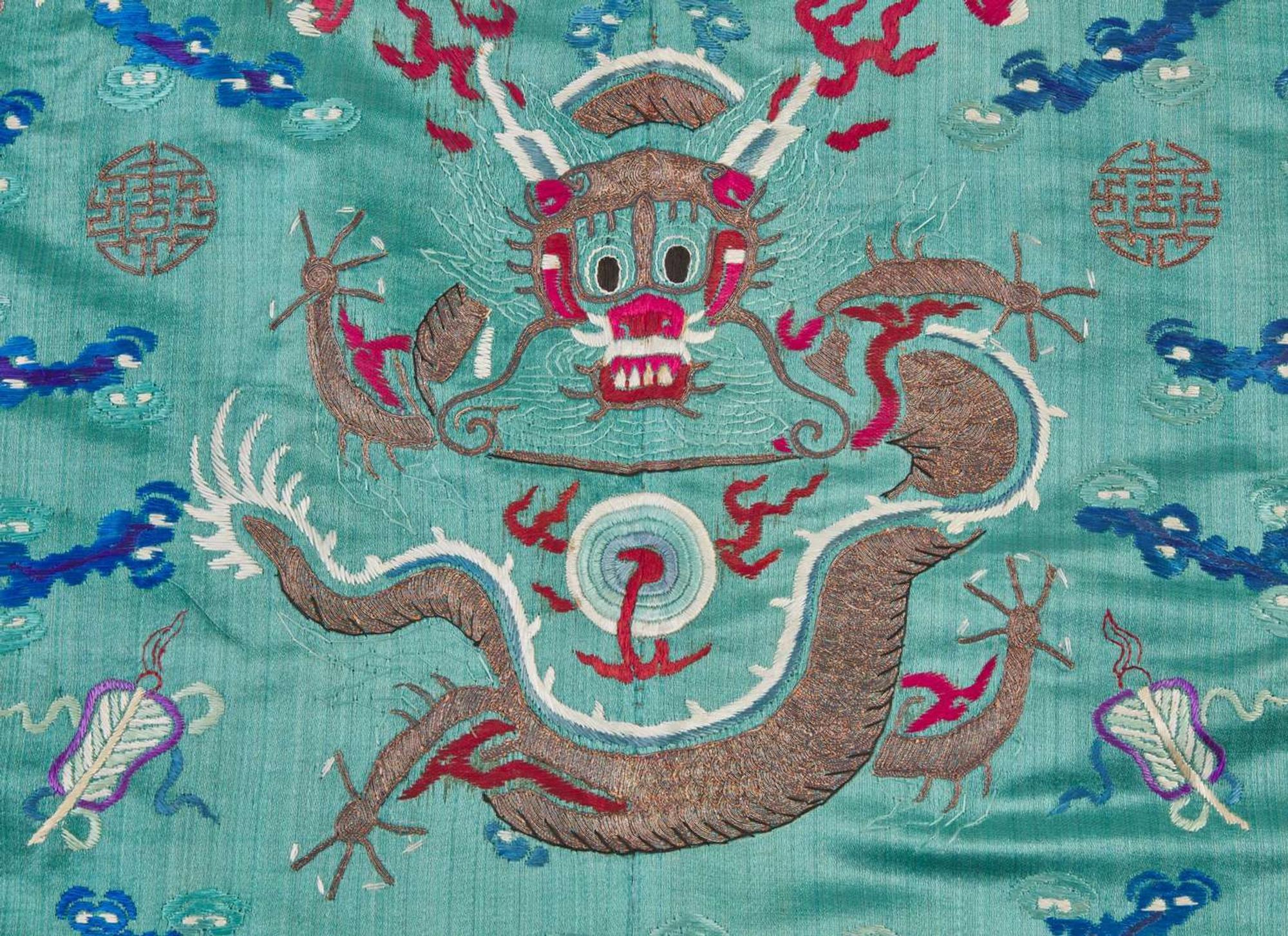 A Chinese embroidered teal blue silk "Dragon" surcoat, late 19th to 20th century 刺繡青藍龍紋袍 十九或二十世紀