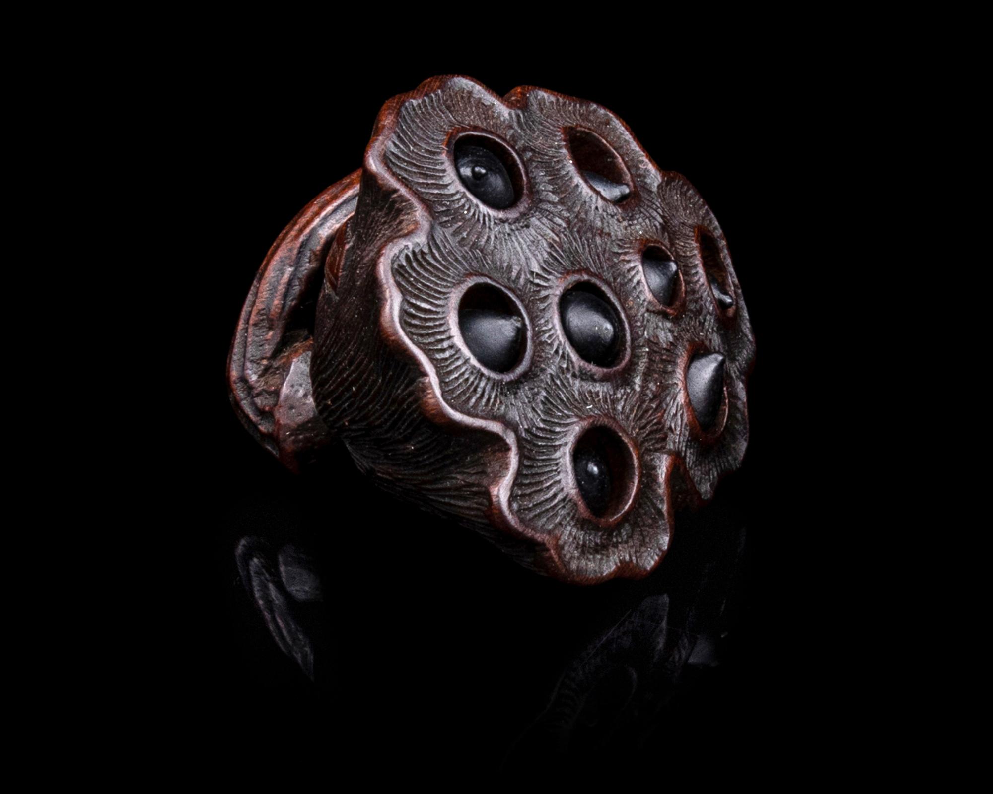 A Japanese Wood Netsuke of Lotus Pod