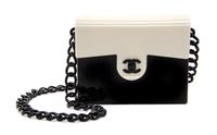 A Chanel Black and White Lucite Handbag, 6.75" x 5.5".