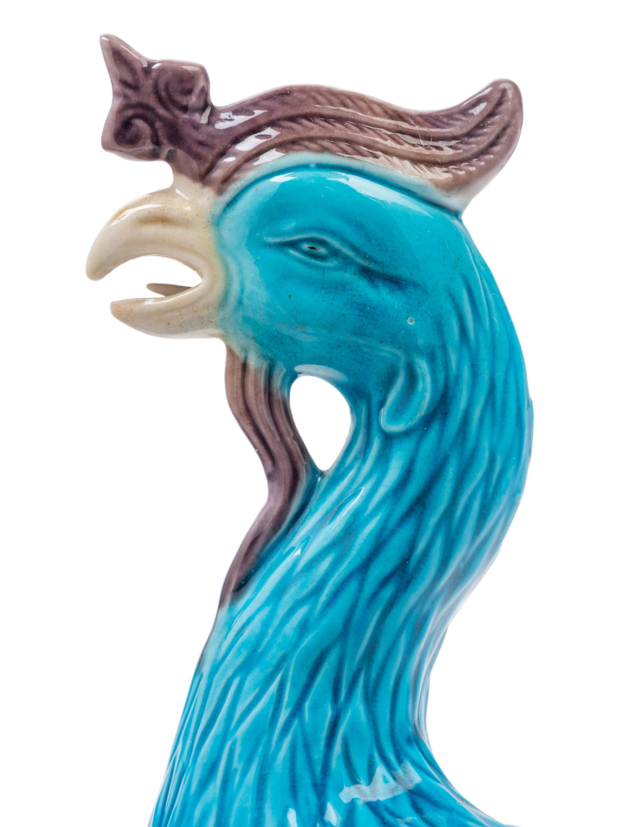 A Pair of Chinese Export Turquoise, White and Purple Glazed Porcelain Figures of Phoenixes