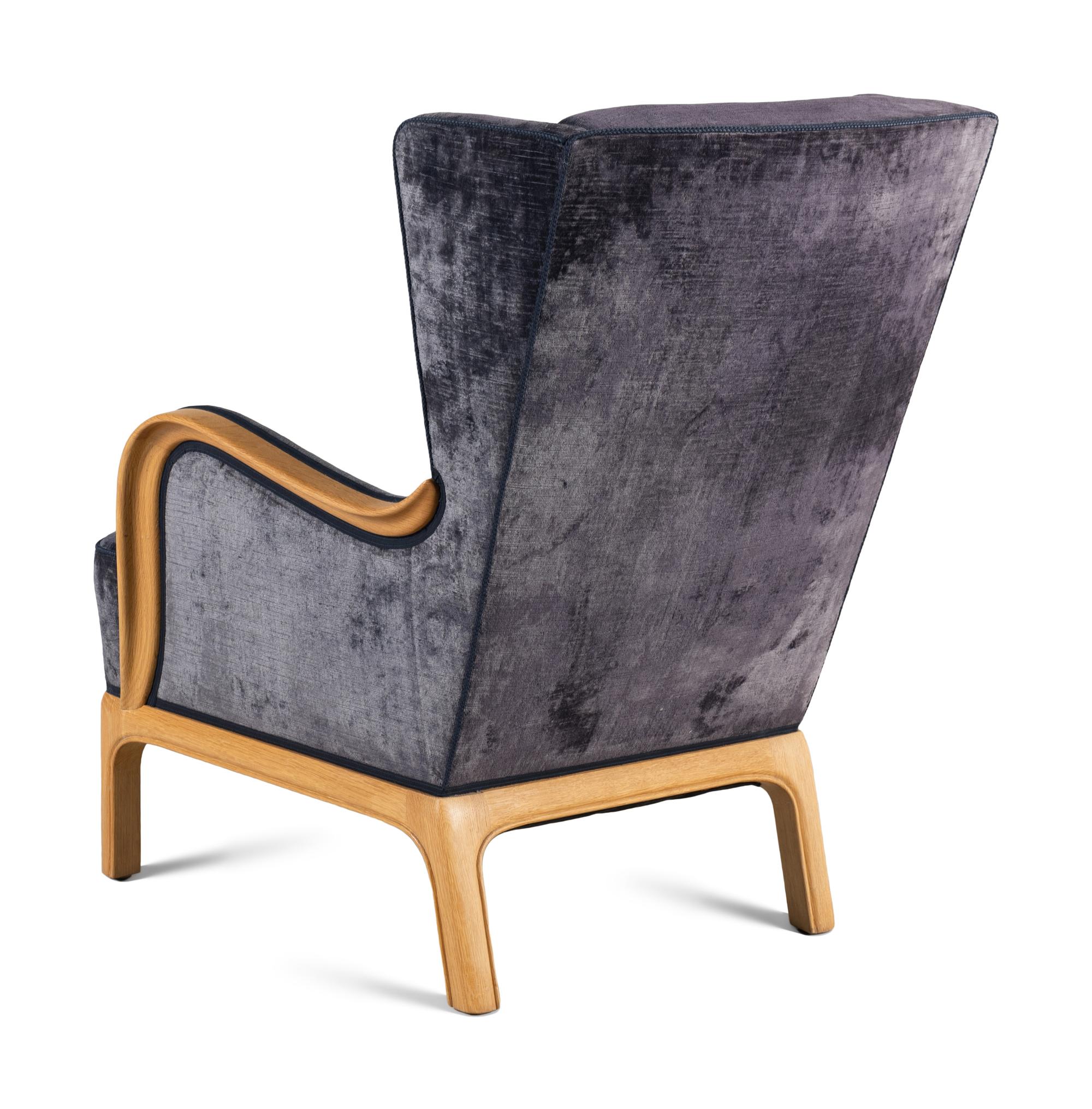 A Contemporary Velvet Upholstered Wing Chair